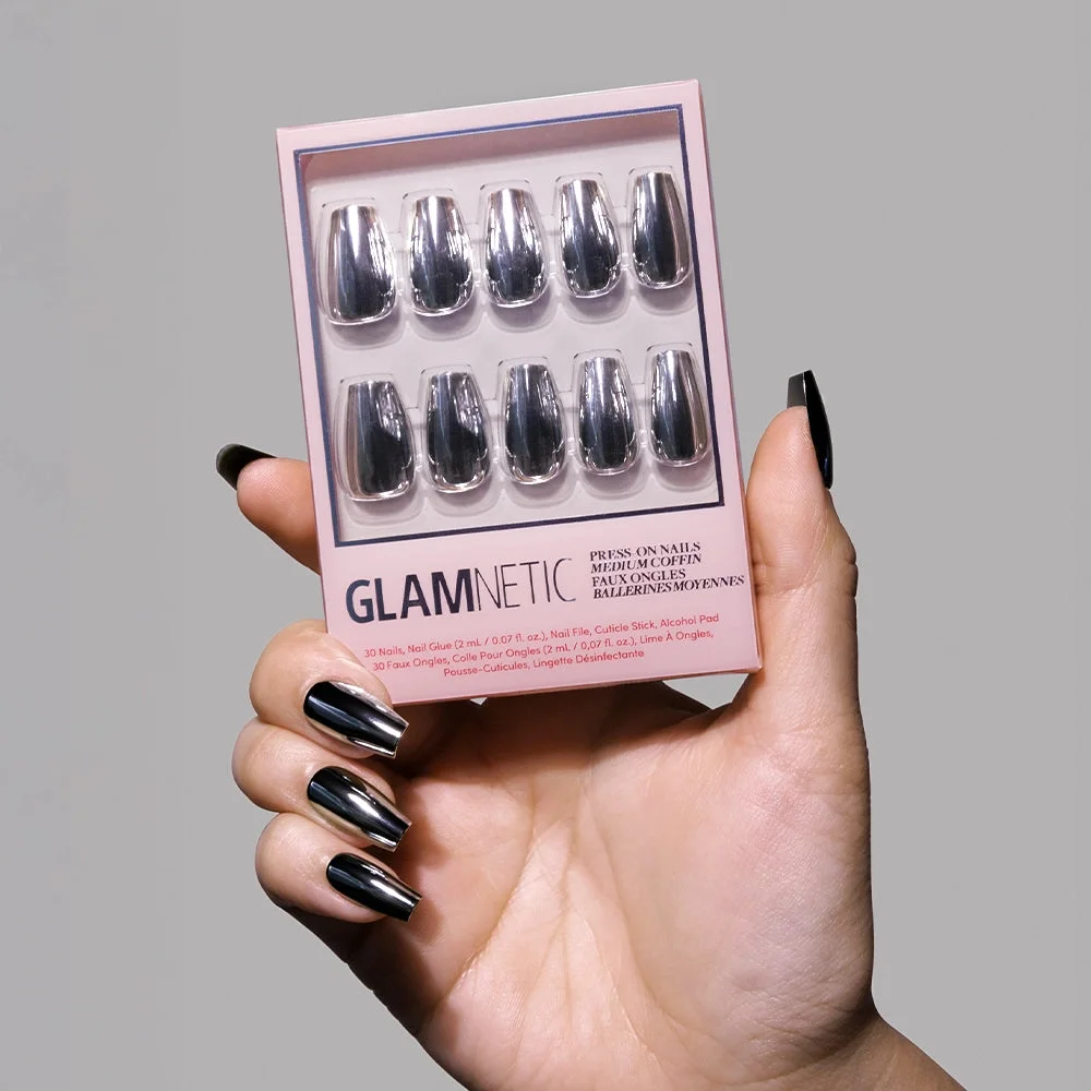 Hand holding a Glamnetic Gunmetal press-on nail kit